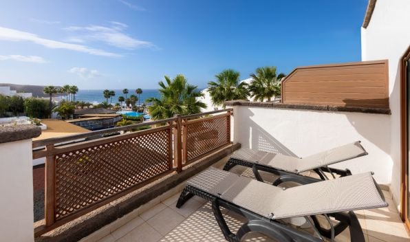 Terrace with sun loungers of the Gold Level Senior Suite Ocean View at Hotel Gran Tagoro