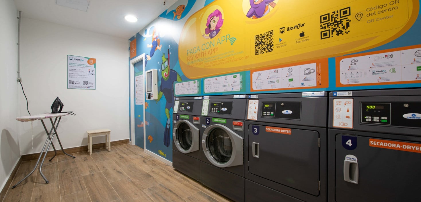 The laundry at Hotel Gran Tagoro features washing machines, tumble dryers, and ironing facilities
